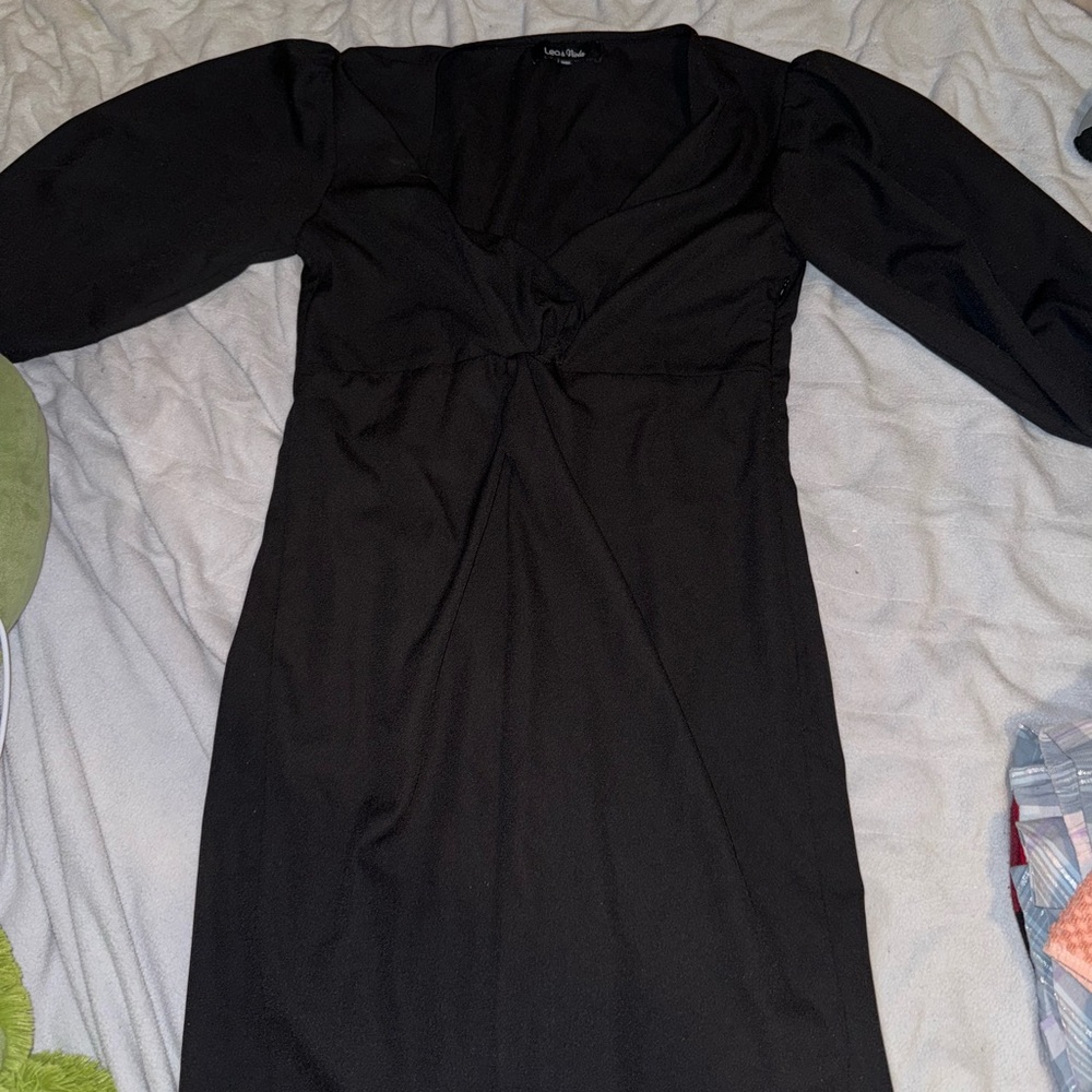 black dress medium length sleeves about above knee length